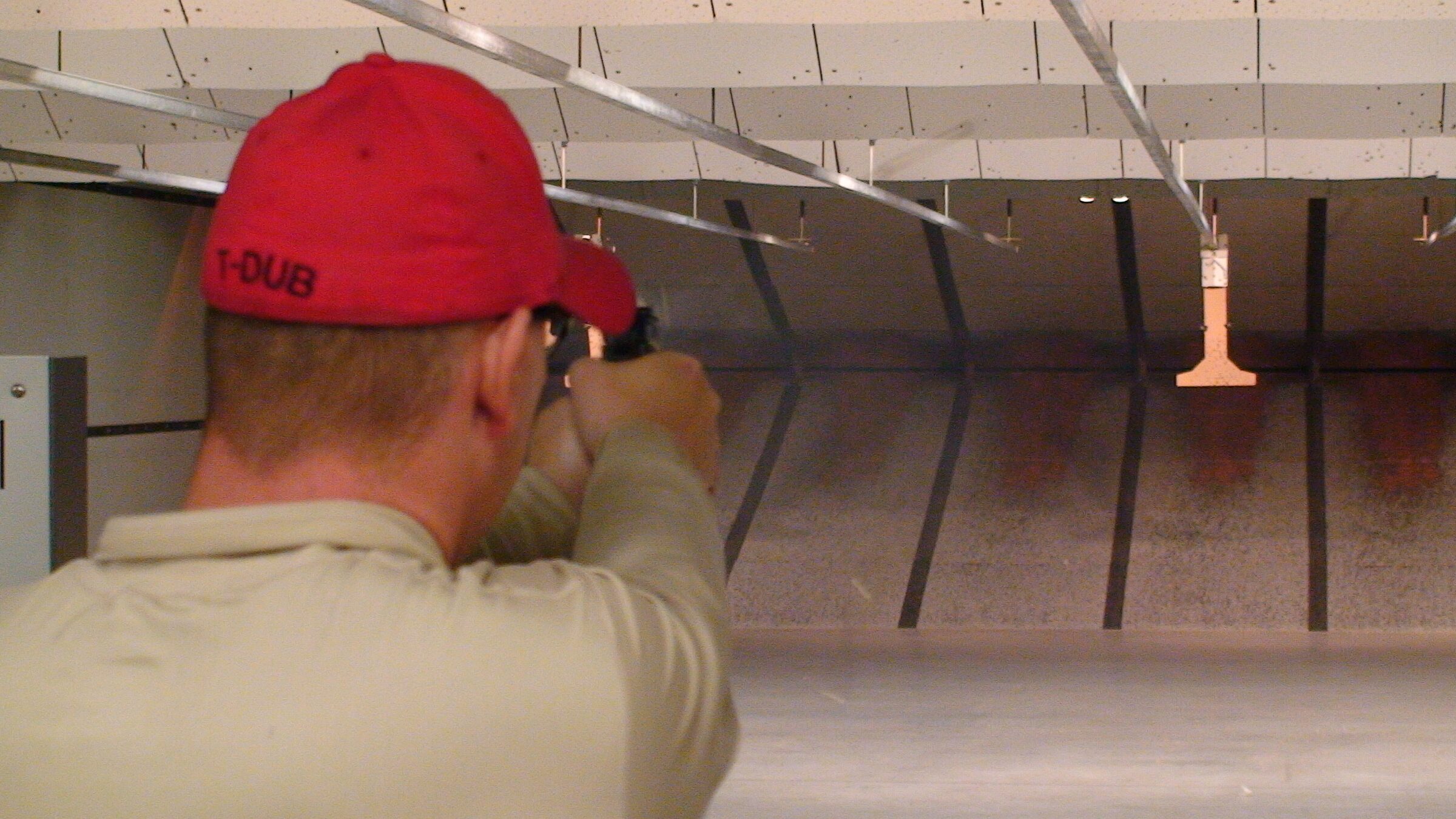 Indoor handgun live-fire training under certified instructor supervision